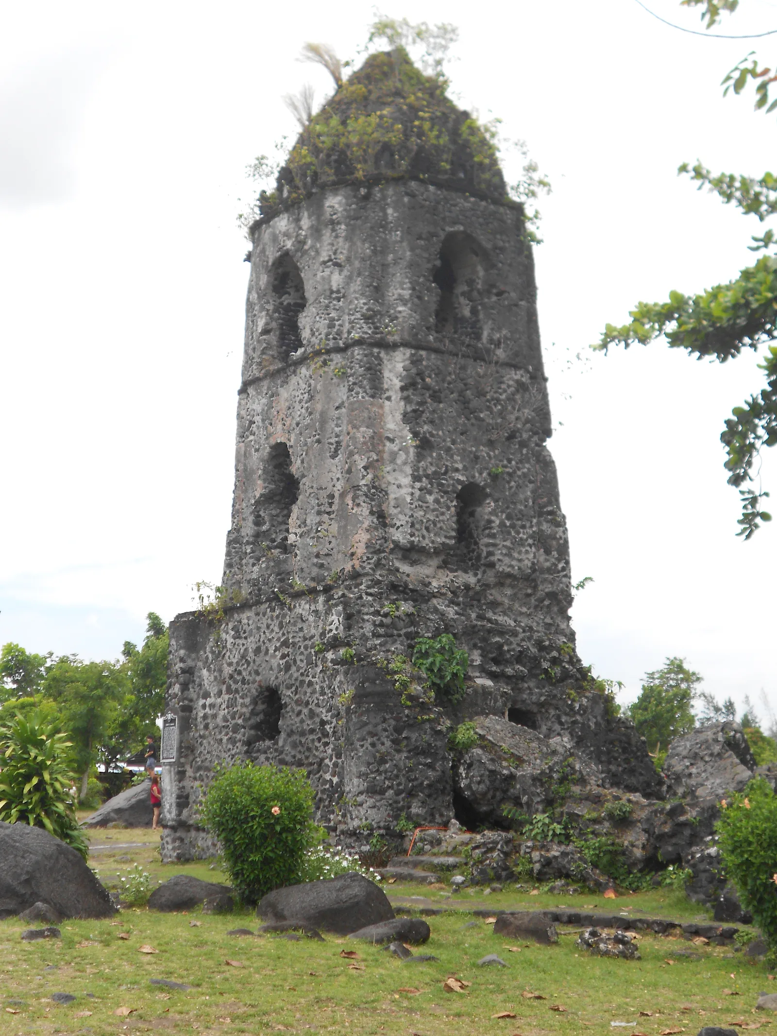 Close vertical view of the weathered Cagsawa church belfry
