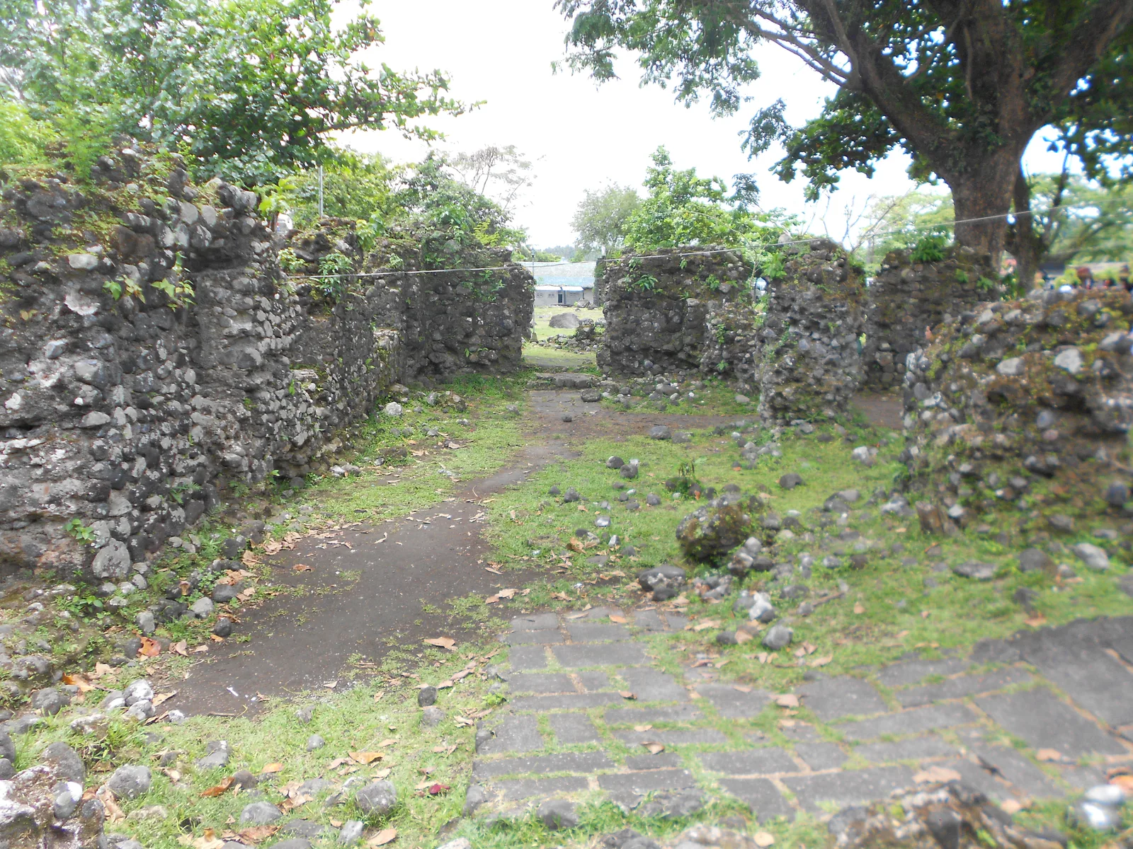 Stone walls and arched openings within the Cagsawa church complex